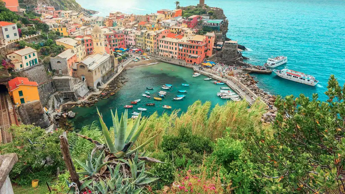 Tour bus and cruise boat used on a Cinque Terre day trip from Milan