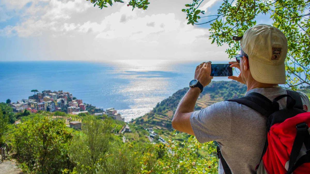 Hikers on the coastal trail between Manarola and Corniglia in the Cinque Terre National Park