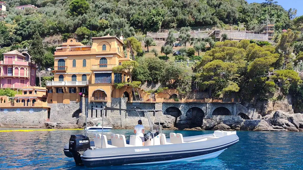 Cruise boat sailing past the Portofino and San Fruttuoso promontory near Santa Margherita Ligure